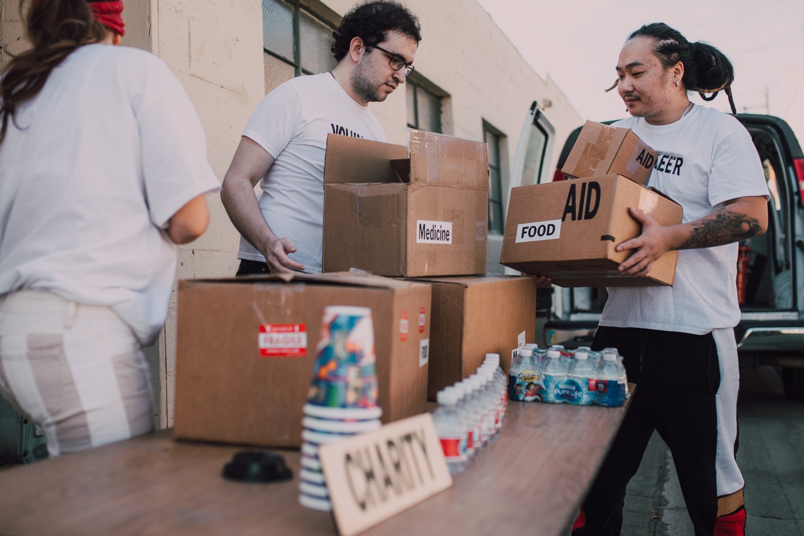 Volunteer People in White Shirts